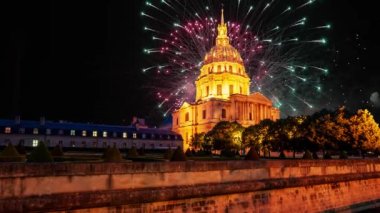 Celebratory colorful fireworks over the Les Invalides (The National Residence of the Invalids) at night. Paris, France