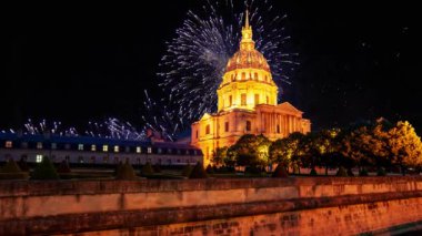 Celebratory colorful fireworks over the Les Invalides (The National Residence of the Invalids) at night. Paris, France