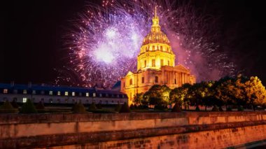 Celebratory colorful fireworks over the Les Invalides (The National Residence of the Invalids) at night. Paris, France