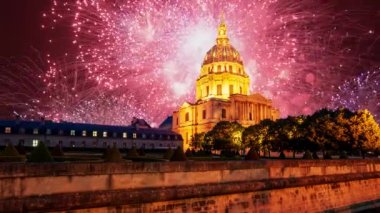 Celebratory colorful fireworks over the Les Invalides (The National Residence of the Invalids) at night. Paris, France