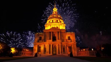 Celebratory colorful fireworks over the Les Invalides (The National Residence of the Invalids) at night. Paris, France