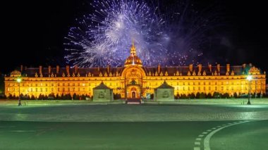 Celebratory colorful fireworks over the Les Invalides (The National Residence of the Invalids) at night. Paris, France