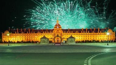 Celebratory colorful fireworks over the Les Invalides (The National Residence of the Invalids) at night. Paris, France