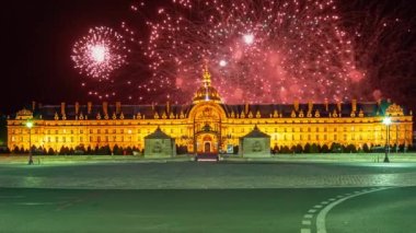 Celebratory colorful fireworks over the Les Invalides (The National Residence of the Invalids) at night. Paris, France