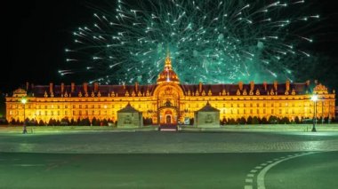 Celebratory colorful fireworks over the Les Invalides (The National Residence of the Invalids) at night. Paris, France