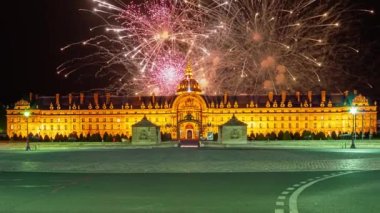 Celebratory colorful fireworks over the Les Invalides (The National Residence of the Invalids) at night. Paris, France