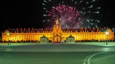 Celebratory colorful fireworks over the Les Invalides (The National Residence of the Invalids) at night. Paris, France