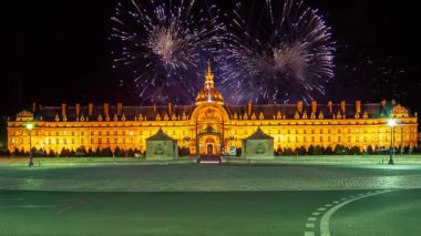 Celebratory colorful fireworks over the Les Invalides (The National Residence of the Invalids) at night. Paris, France