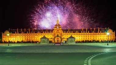 Celebratory colorful fireworks over the Les Invalides (The National Residence of the Invalids) at night. Paris, France