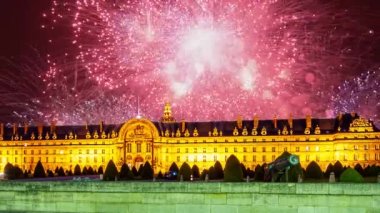 Celebratory colorful fireworks over the Les Invalides (The National Residence of the Invalids) at night. Paris, France