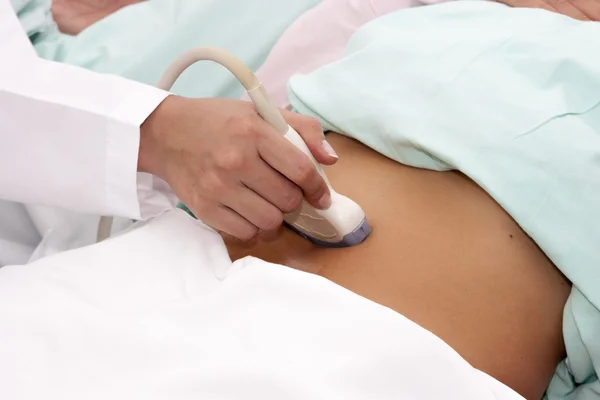 Scanning of a stomach of pregnant woman — Stock Photo, Image