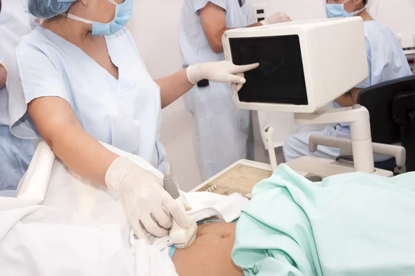 Scanning of a stomach of pregnant woman — Stock Photo, Image