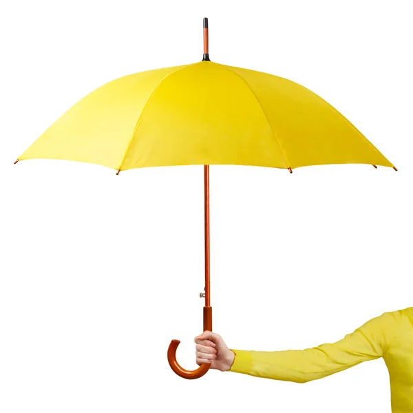 Mão segurando um guarda-chuva amarelo — Fotografia de Stock