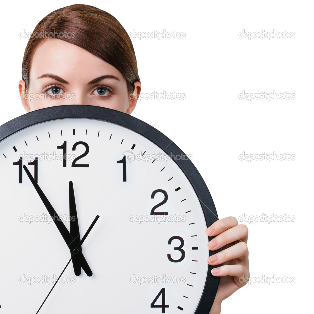 Young woman holding a clock