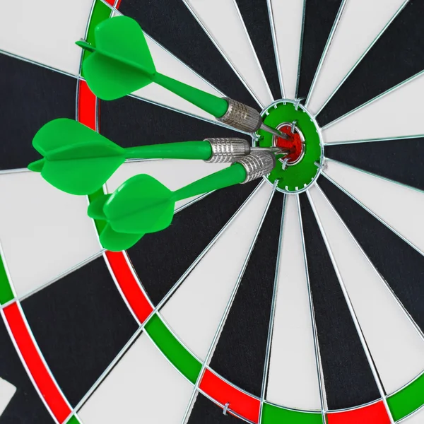 Darts arrows in the target center — Stock Photo, Image