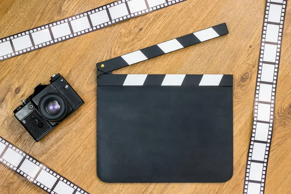 Film slate and film strips — Stock Photo, Image