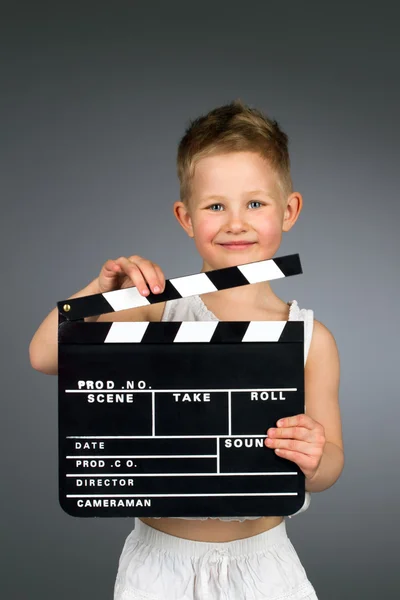 Kid holding movie clapper board — Stock Photo, Image