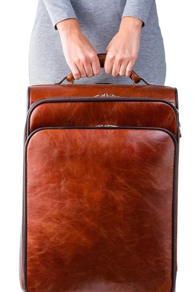 Woman holds leather suitcase — Stock Photo, Image