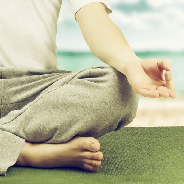 Young man in lotus pose. — Stock Photo, Image