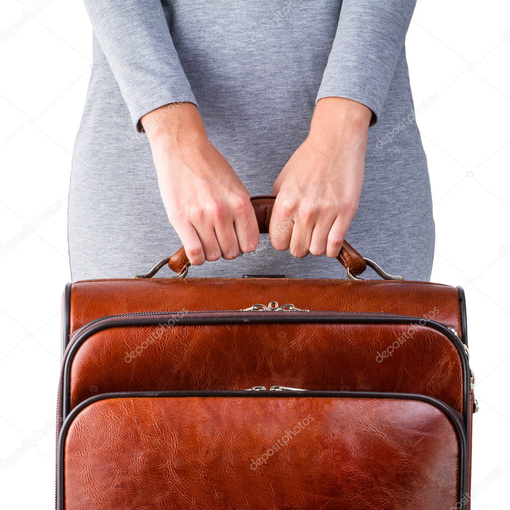 Woman holds leather suitcase