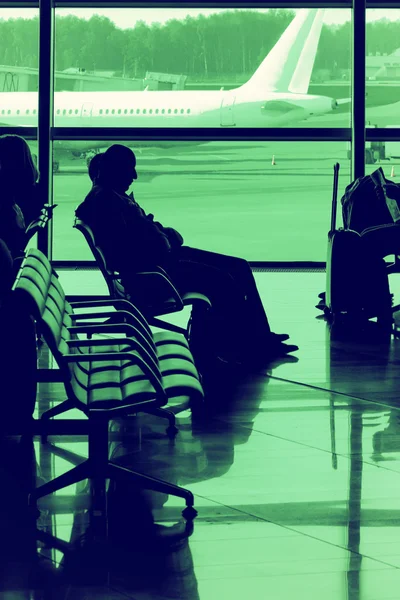 Passengers waiting for flight — Stock Photo, Image