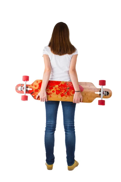 Woman holding skateboard — Stock Photo, Image