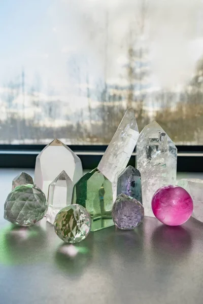 Closeup of spiritual healing crystals against a window