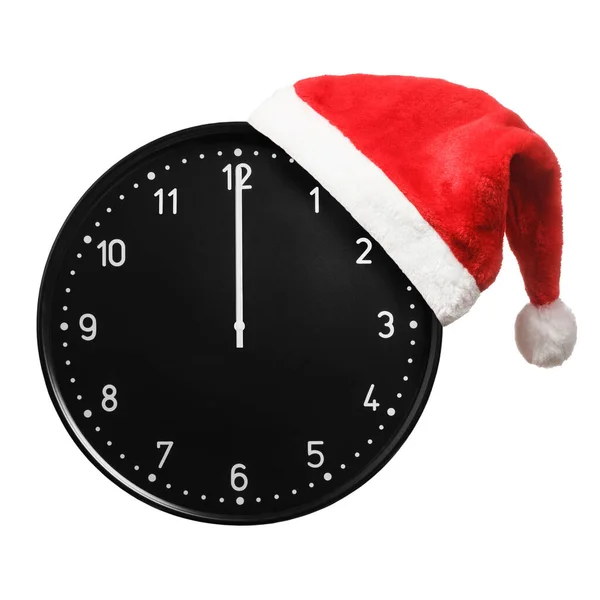 Santa hat and office clock — Stock Photo, Image