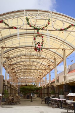 ORANJESTAD, ARUBA - DECEMBER 4, 2021:  Entrance of the Renaissance Marketplace shopping mall, which houses many restaurants, cafes and bars, located in the city center of Oranjestad on the Caribbean island of Aruba