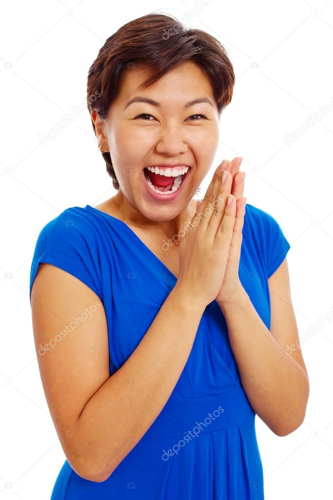 Cheerful clapping hands teenage girl