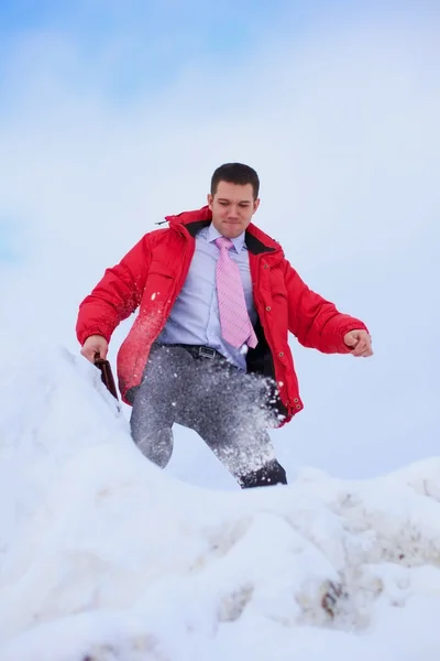 Business man on snowdrift outdoor — Stock Photo, Image