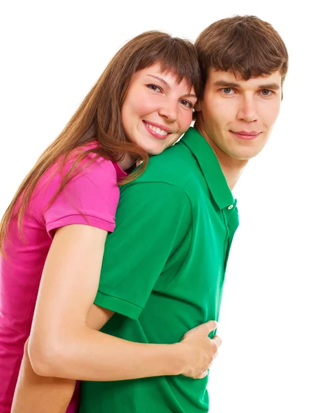 Adorável jovem casal olhando para a câmera contra branco — Fotografia de Stock