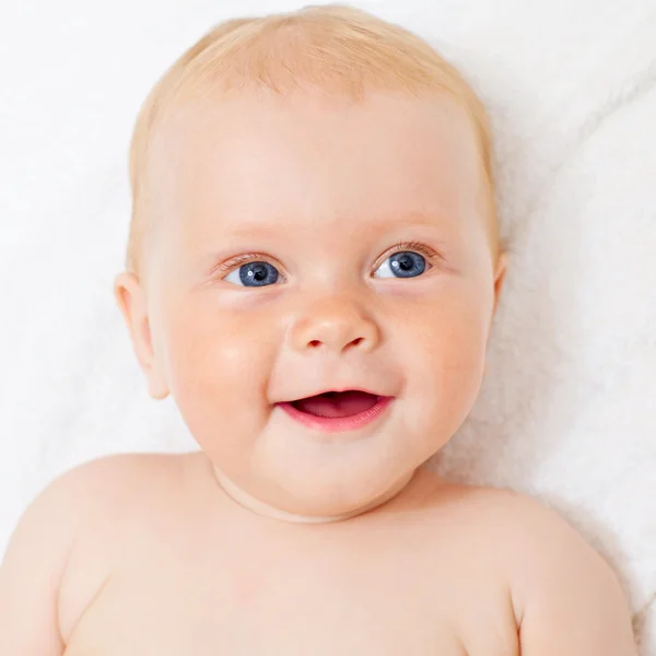 Cute pleased kid on towel — Stock Photo, Image