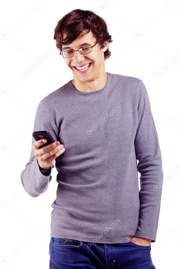 Joyful guy enjoying his cell phone