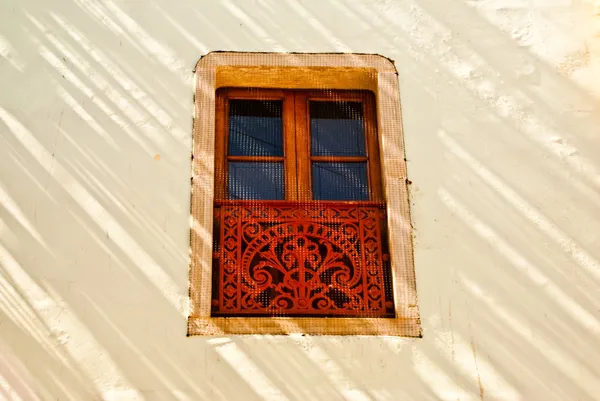 Decorative window in sunlight and shadow — Stock Photo, Image