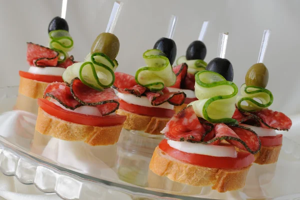 Canapés with salami — Stock fotografie