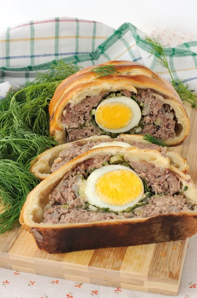 Meatloaf with egg and greens in the test — Stock Photo, Image