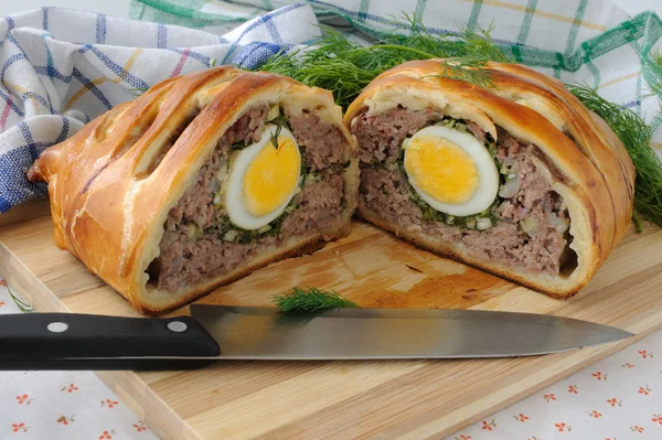 Meatloaf with egg and greens in the test — Stock Photo, Image