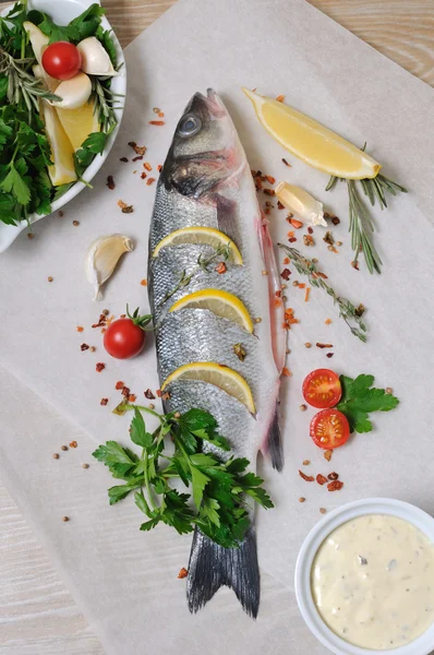 Fresh sea bass with lemon and spices — Stock Photo, Image