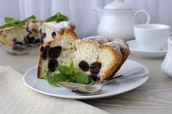 Pieces of sponge cake with cherries — Stock Photo, Image