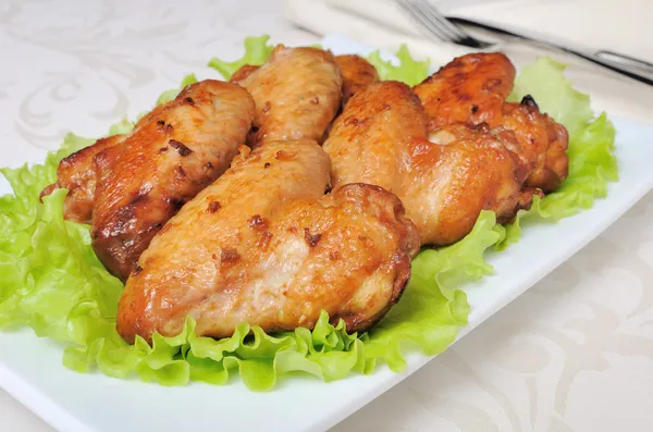 Baked chicken wings with garlic — Stock Photo, Image