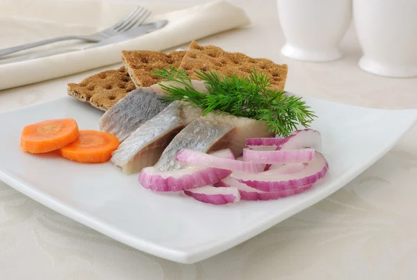 Slices of salted herring with onions — Stock Photo, Image