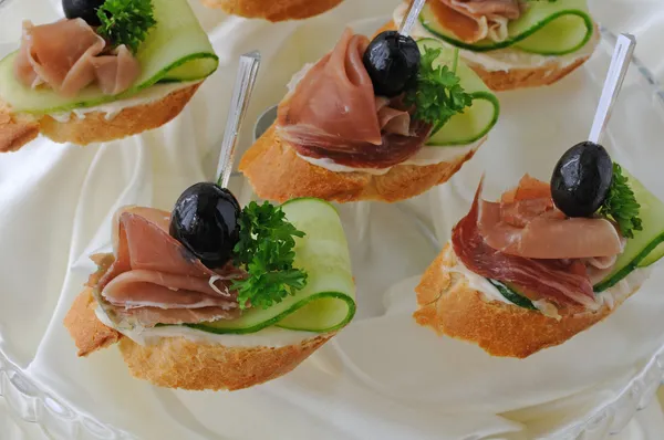 Canapes with ham — Stock Photo, Image