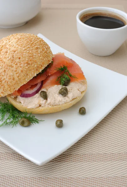 Salmon sandwich and a cup of coffee — Stock Photo, Image