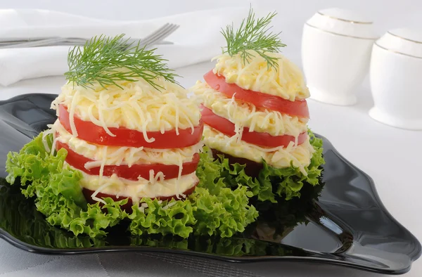 Appetizer of tomato slices with a sharp cheese filling — Stock Photo, Image