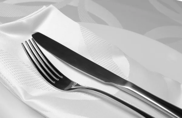 Knife and fork on a napkin — Stock Photo, Image
