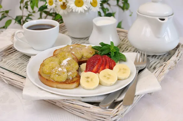 French toast with a banana syrup for breakfast — Stock Photo, Image