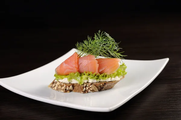 Canapes with salmon — Stock Photo, Image