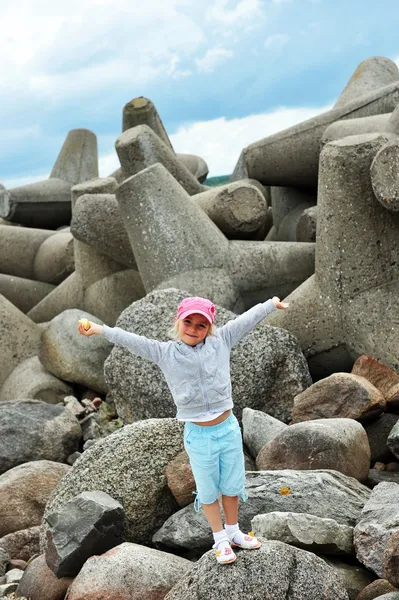 Girl on stones — Stock Photo, Image