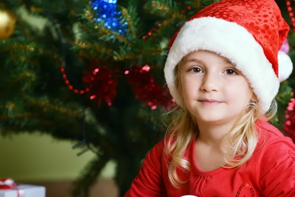 Menina em santa cap — Fotografia de Stock